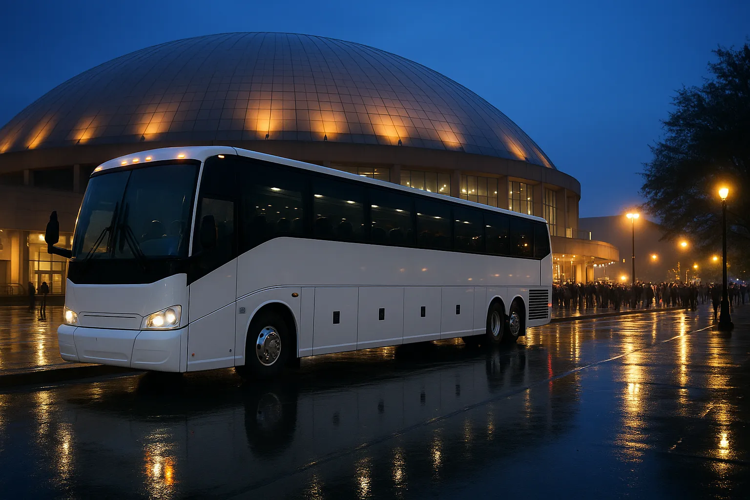 Motorcoach waiting outside a large domed arena on an overcast afternoon